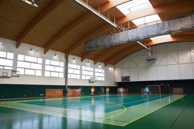 Interior of a modern multifunctional gymnasium with young