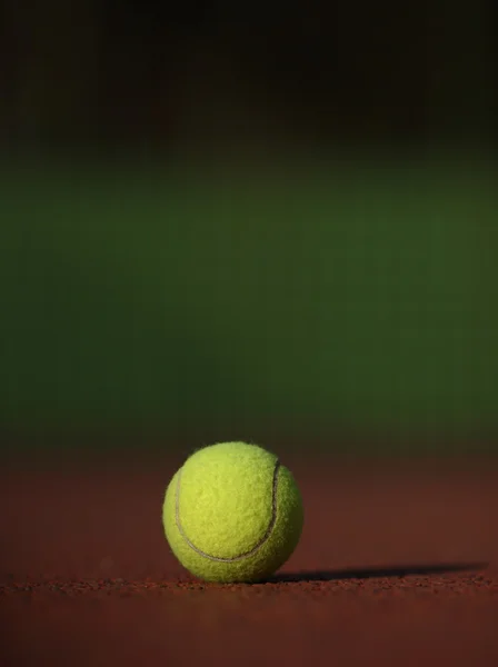 Tennis ball on the court — Stock Photo, Image