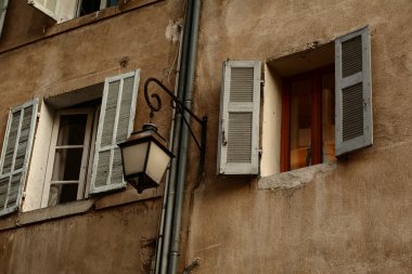 Windows with shutters of an old house in southern France (Provence). clipart