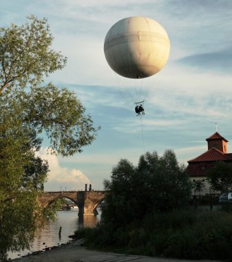 Hot air airship above Charles bridge in Prague, Czech republic clipart