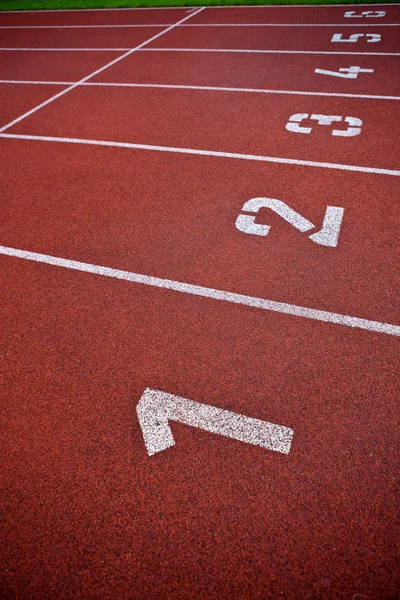 Spor zemin kavramı - Atletizm lane numaraları takip. — Stok fotoğraf