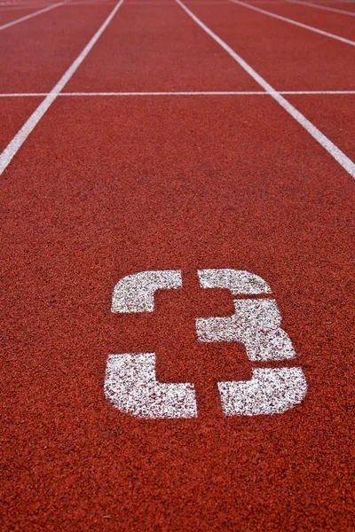 Sport gronden concept - Atletiek bijhouden lane nummers — Stockfoto