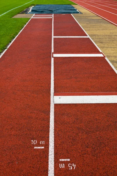Conceito de terreno desportivo - Pista de atletismo — Fotografia de Stock