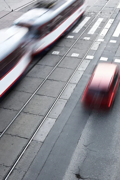 City street with a crossing, rail, motion blurred — Stock Photo, Image