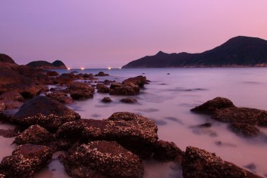 Sunset along the coast. Nature composition under long exposure. clipart