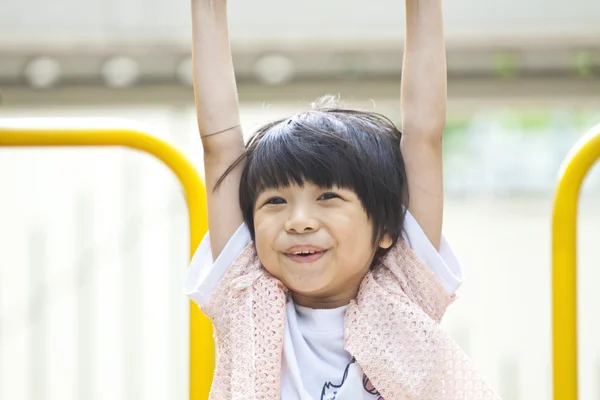 Asian girl playing in park — Stock Photo, Image