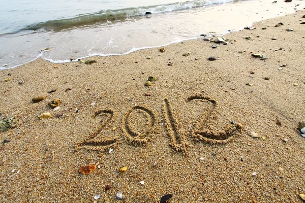 2012 Jahr auf dem Sand am Strand geschrieben — Stockfoto