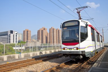 Moving train in Hong Kong at day clipart