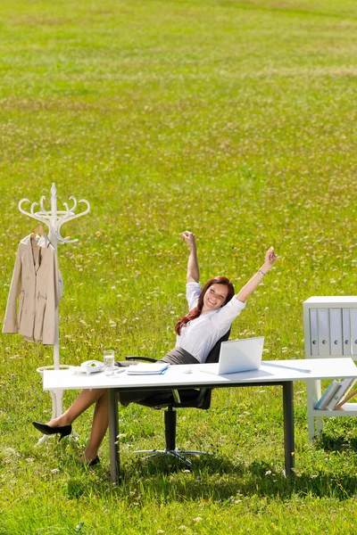 Businesswoman stretch sunny meadow nature office — Stock Photo, Image