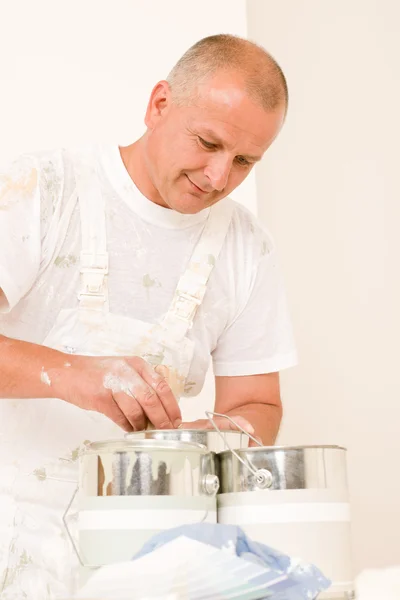 Home decorating mature male painter mixing color — Stock Photo, Image