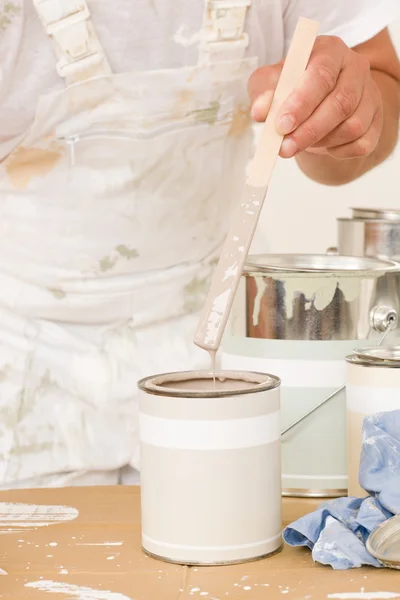 Home decorating mixing up paint color can — Stock Photo, Image