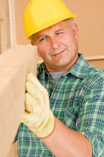Handyman mature carpenter measure wooden beam — Stock Photo, Image