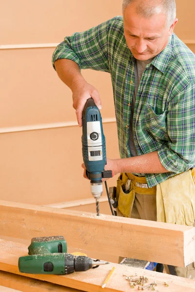Handyman home improvement drilling wood Stock Picture