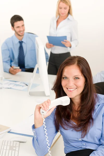 Business team pretty businesswoman holding phone — Stock Photo, Image