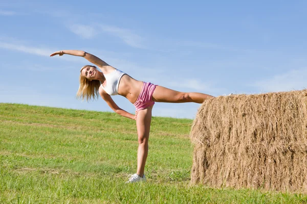 Stretching sport fit woman summer blue sky — Stock Photo, Image