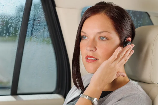 Executive businesswoman luxury car call hands-free — Stock Photo, Image