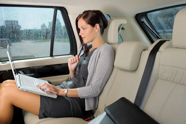 Executive businesswoman work laptop car backseat — Stock Photo, Image