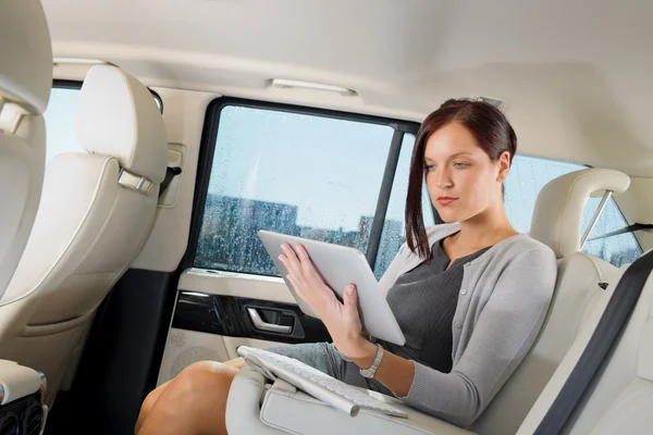 Executive businesswoman in car work touch tablet — Stock Photo, Image