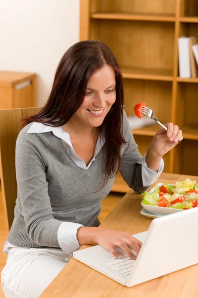 Home working lunch smiling woman with laptop Stock Photo