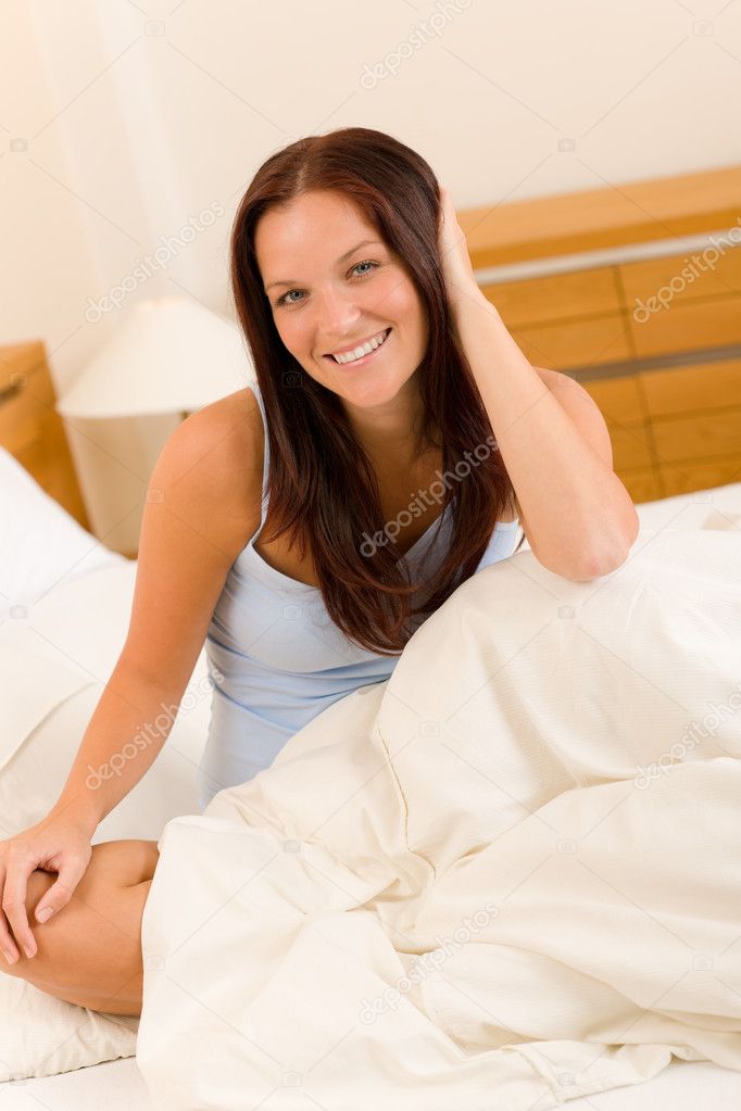Bedroom - beautiful woman waking up white bed