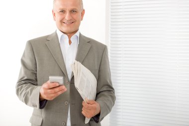 Businessman mature smiling hold phone portrait clipart