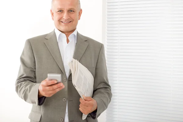 Businessman mature smiling hold phone portrait — Stock Photo, Image