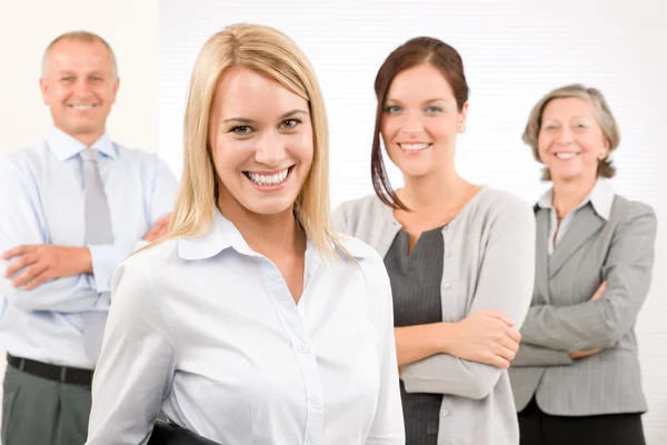 Business team young woman with mature colleagues — Stock Photo, Image