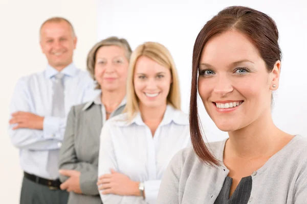 Business team happy standing in line portrait Stock Picture