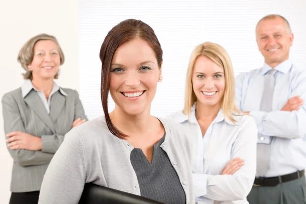 Business team young woman with mature colleagues Royalty Free Stock Photos