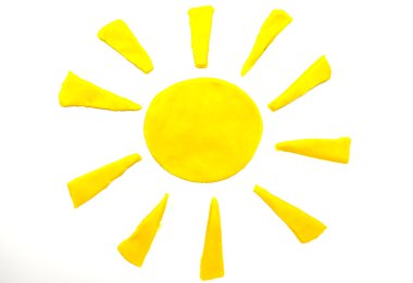 Painted yellow sun of plasticine on background clipart