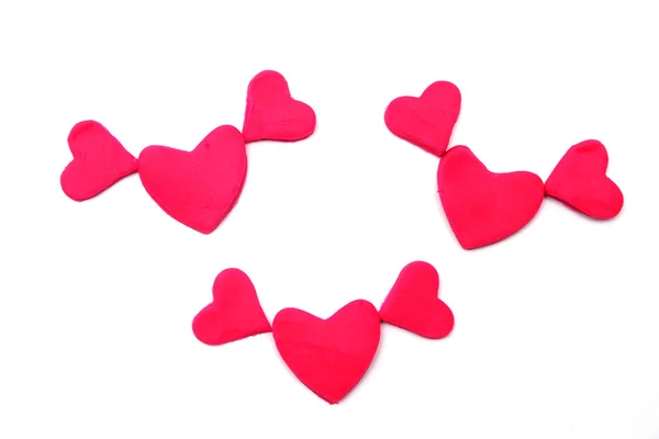 Bemalte rosa Herzen aus Knetmasse auf Hintergrund — Stockfoto