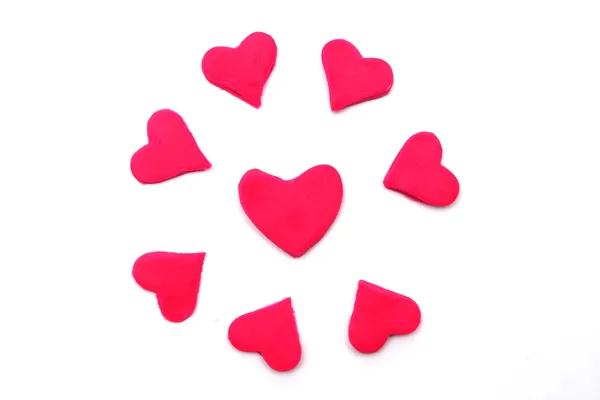 Pintado corações cor-de-rosa de plasticina no fundo — Fotografia de Stock