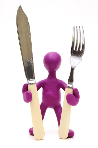 Purple puppet standing with tableware — Stock Photo, Image