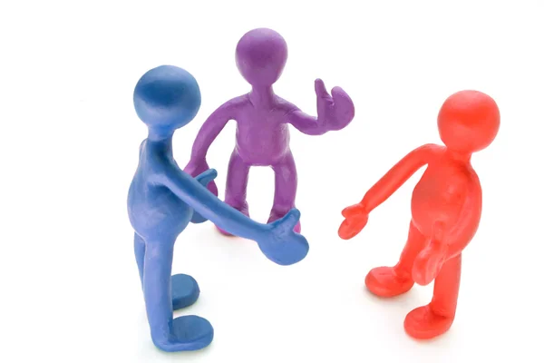 Colored plasticine puppets talking on white background — Stock Photo, Image