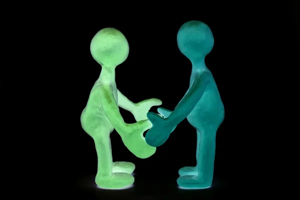 Shaded plasticine puppets standing opposite each other — Stock Photo, Image