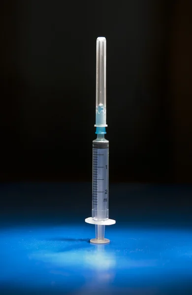 Empty medical syringe standing head up — Stock Photo, Image