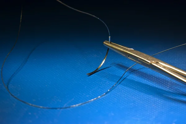 Needle waiting coming surgery on studio ground — Stock Photo, Image