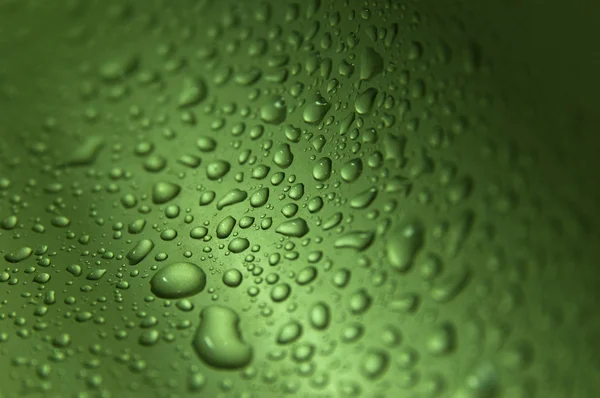 Drops on green wavy background making texture — Stock Photo, Image