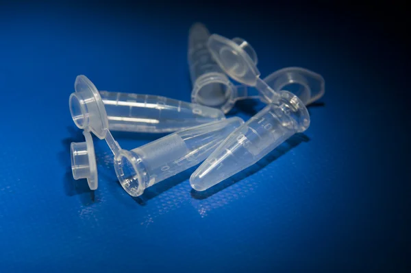 Tubes laying on table empty and open — Stock Photo, Image