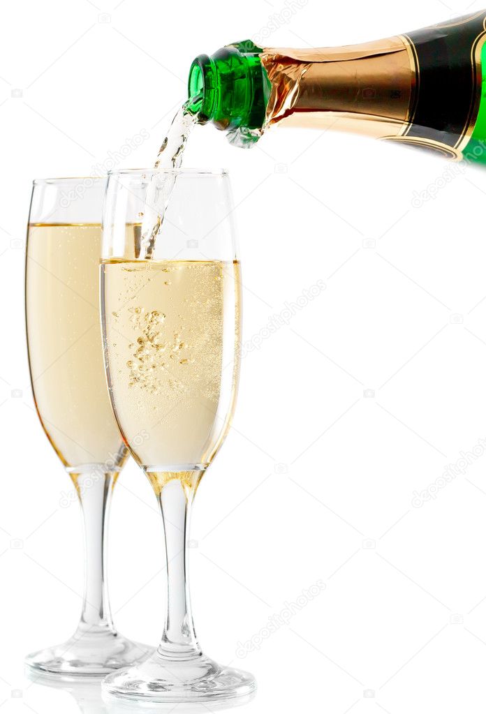 Champagne being poured into glass or flute, isolated on a white