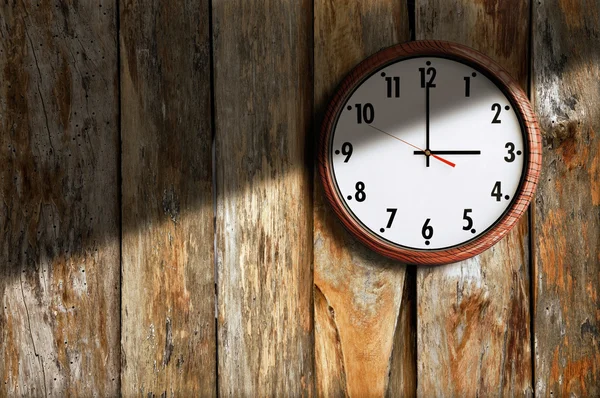 Clock on background the old wall wooden. — Stock Photo, Image
