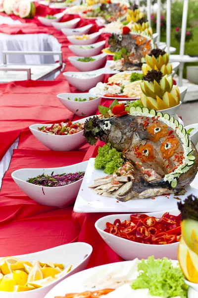 stock image Celebratory food: stuffed fish on served table