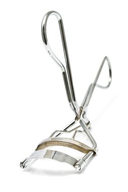 Macro of eyelash curler clipart