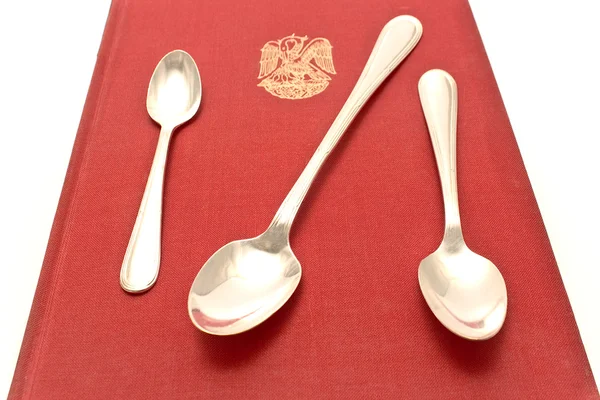 Threes silver spoons on red — Stock Photo, Image