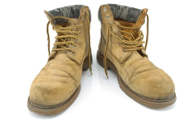 Staré špinavé žluté pracovní boty — Stock fotografie