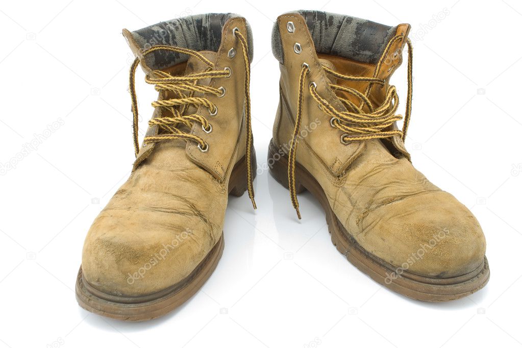 Old dirty yellow working boots
