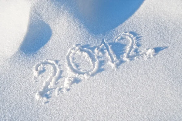 Ano 2012 escrito na neve — Fotografia de Stock