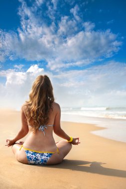 Yoga meditation on the beach clipart