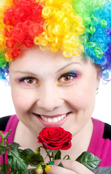 Clown with rainbow make up with rose — Stock Photo, Image