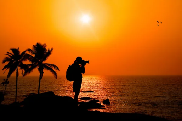 Photographer silhouette at sunset — Stock Photo, Image